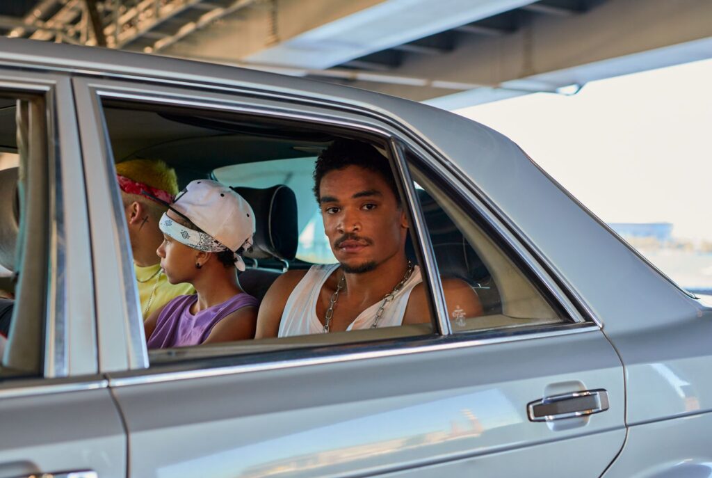 Executive in the back seat of a car after a private flight into Dallas
