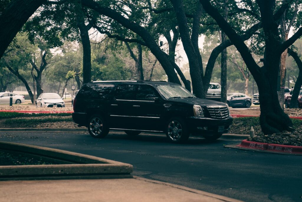 Black Cadillac Escalade SUV, private jet car service in Dallas