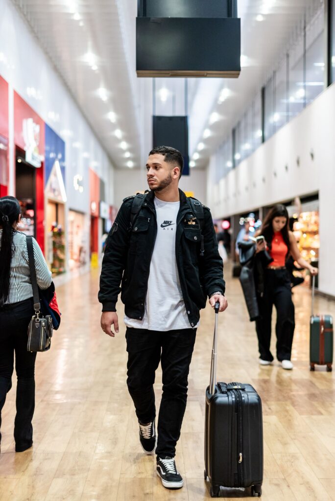 Traveler walking through a modern airport terminal, Irving to DFW Airport