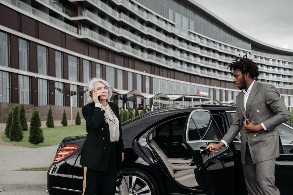Chauffeur opening a car door for a passenger, Dallas Love Field car service